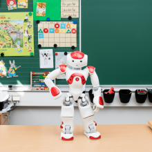 Robot in front of blackboard